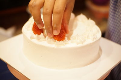 Close-up of hand holding ice cream