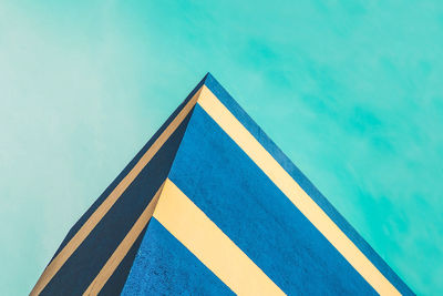 Low angle view of blue building against blue sky