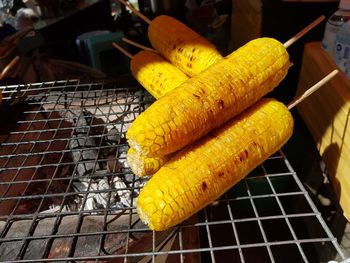 Close-up of yellow meat on barbecue grill