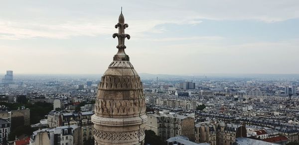 Aerial view of city buildings against sky