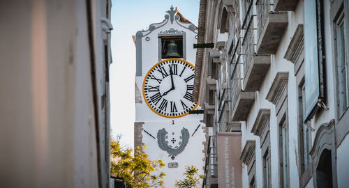 Clock tower on wall of building