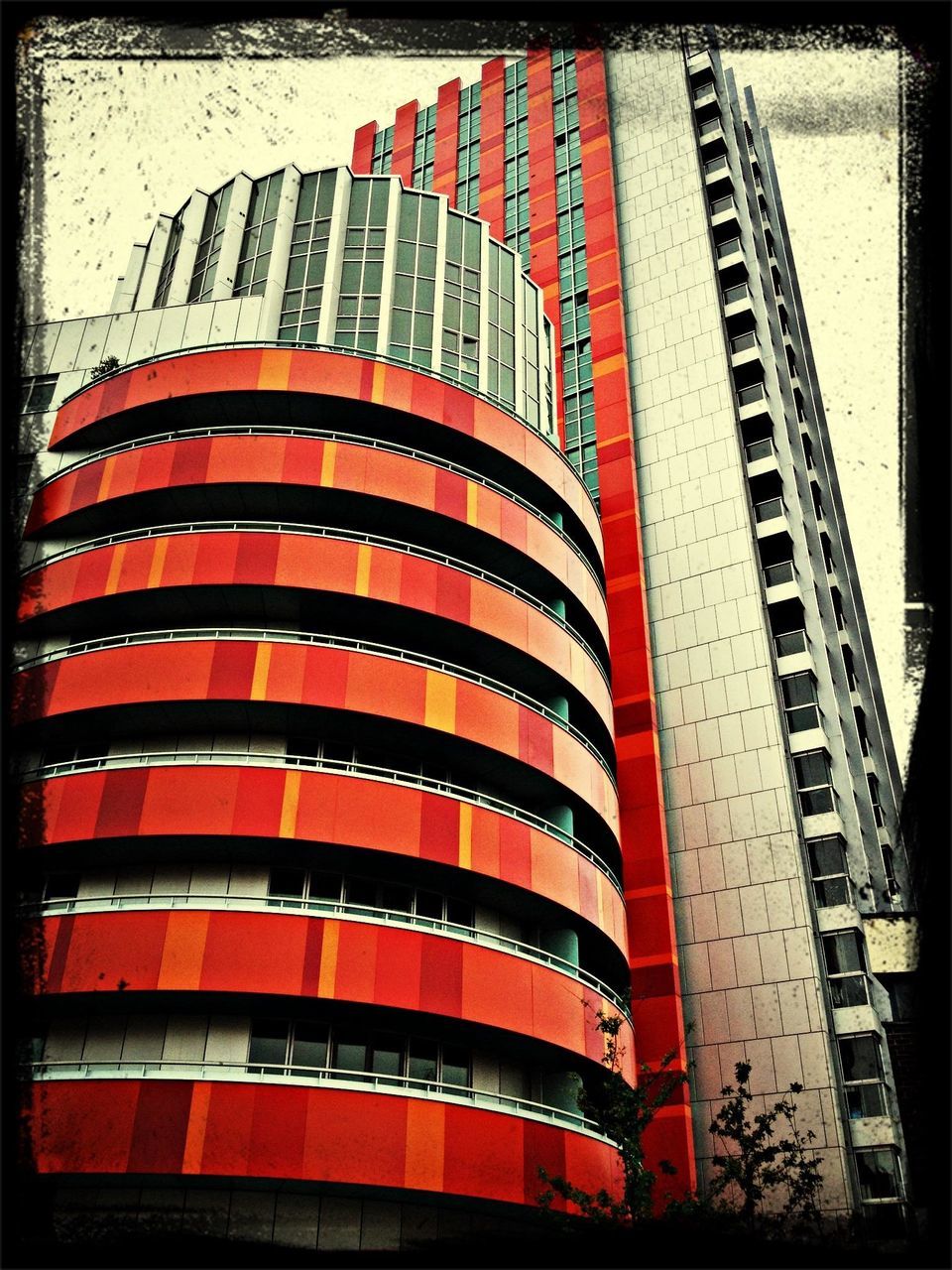 building exterior, architecture, built structure, low angle view, american flag, flag, patriotism, red, identity, national flag, city, striped, modern, auto post production filter, building, transfer print, office building, sky, skyscraper, day