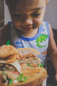 Close-up, the boys were tempted and wanted to taste the burger