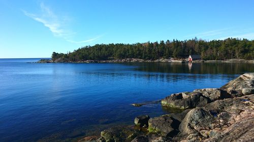 Scenic view of sea against blue sky