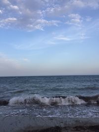 Scenic view of beach and sea against sky