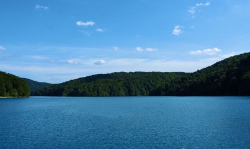 Scenic view of lake against blue sky