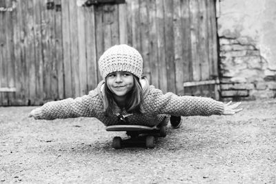 Portrait of girl sitting in snow