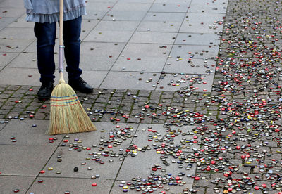 German tradition, sweeping with a broom in front of hamburg town hall on turning 30 year old