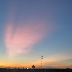 Silhouette built structure against sky during sunset