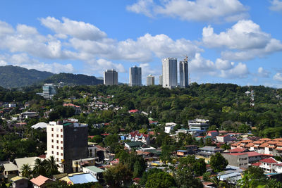 Buildings in city against sky