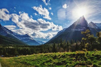 Scenic view of mountains against sky during sunny day