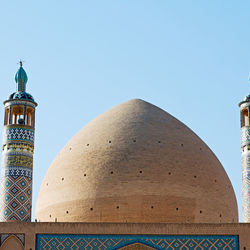 Low angle view of building against clear blue sky