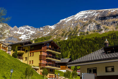 Houses and buildings against clear sky