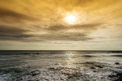 Scenic view of sea against sky at sunset