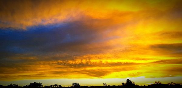 Low angle view of dramatic sky during sunset