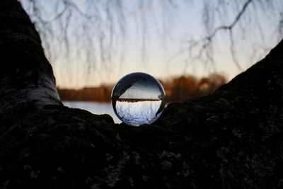 Close-up of crystal ball on rock