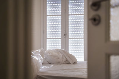 White curtain on bed at home