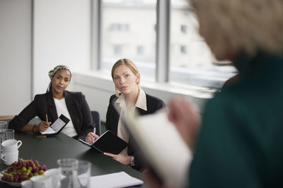 Women sitting at business meeting