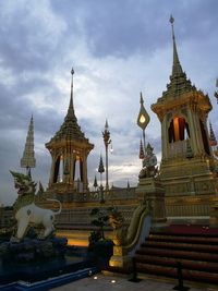 Statue of temple against cloudy sky