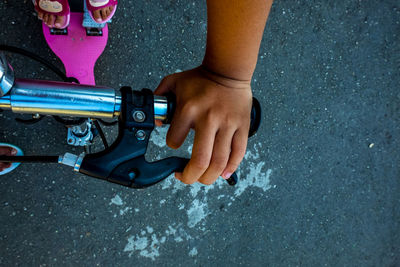 Low section of woman standing on street