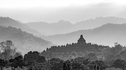 Panoramic view of church and mountains against sky