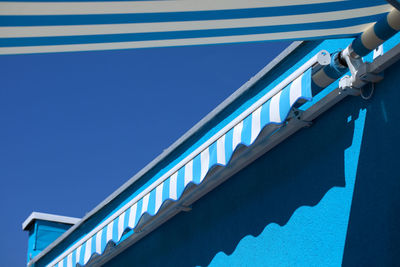 Low angle view of building against clear blue sky