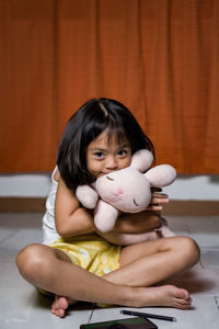 Portrait of cute girl with toy