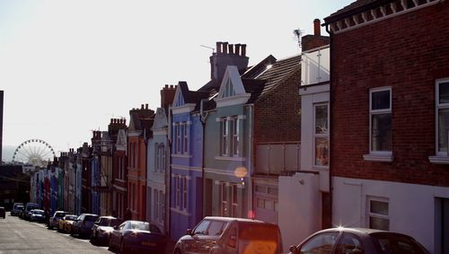 Street amidst buildings against sky