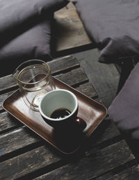 High angle view of coffee in cup on table