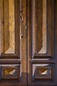 Full frame shot of closed wooden door of building