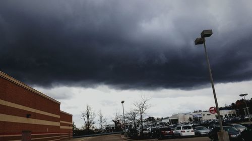 Low angle view of building against cloudy sky