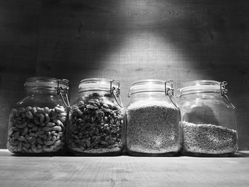 Close-up of food in glass jars on table