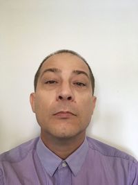 Portrait of young man against white background