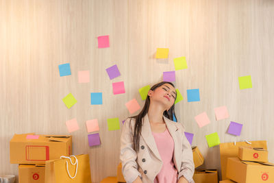 Woman standing against wall