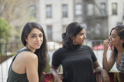 Young women talking at a party