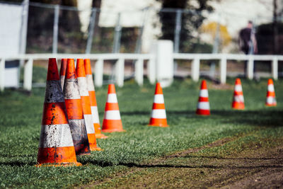 Close-up of traffic cone on grass