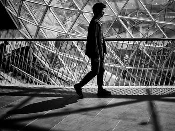 Man walking on footbridge