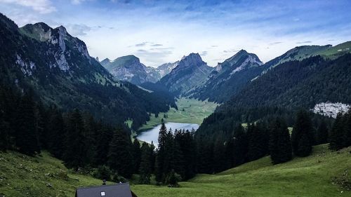 Scenic view of silhouette mountains against sky