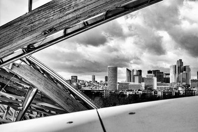 Cityscape seen from roof of louis vuitton foundation against cloudy sky