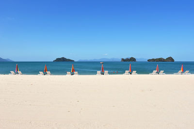 Scenic view of sea against clear blue sky in tanjung rhu, langkawi island, malaysia