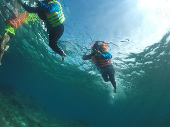 People swimming in sea