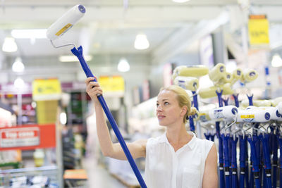 Mid adult woman standing in departmental store