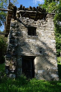 Low angle view of abandoned house