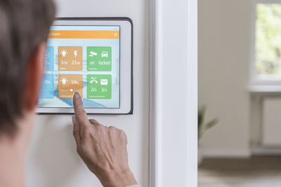 Woman using smart home screen