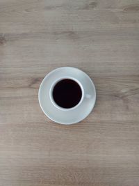 Directly above shot of coffee cup on table