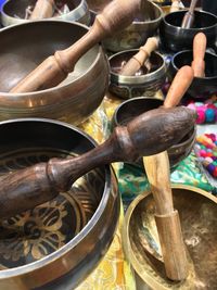 High angle view of wooden mortar and pestles for sale at market stall