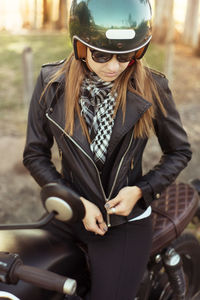 High angle view of young woman on motorbike