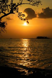 Scenic view of sea against romantic sky at sunset