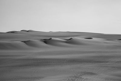 Scenic view of desert against clear sky