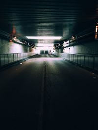 Road in illuminated tunnel